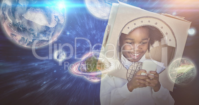 Composite image of boy playing as an astronaut
