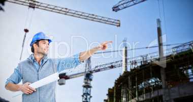 Composite image of architect pointing