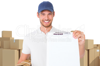 Composite image of happy delivery man holding cardboard box and clipboard