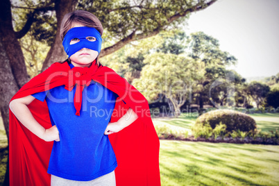 Composite image of masked girl pretending to be superhero