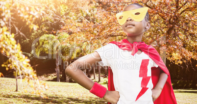 Composite image of portrait of child pretending to be a superhero
