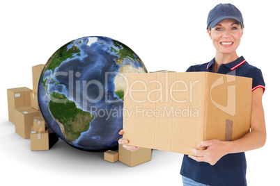 Composite image of happy delivery woman holding cardboard box