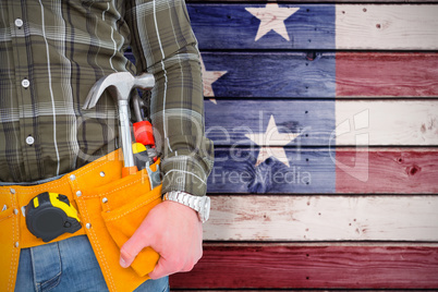 Composite image of handyman wearing tool belt