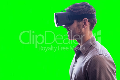 Composite image of profile view of businessman holding virtual glasses
