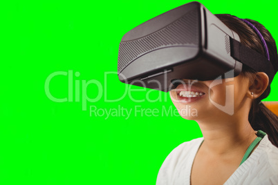 Composite image of close up of little girl holding virtual glasses