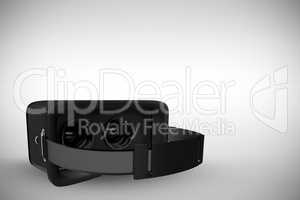 Composite image of black virtual reality simulator over white background