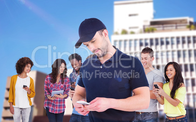 Composite image of smiling man using mobile phone