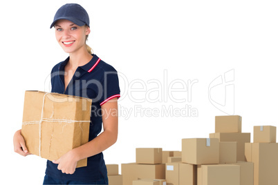 Composite image of happy delivery woman holding cardboard box