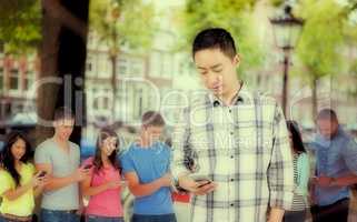 Composite image of young man using smart phone