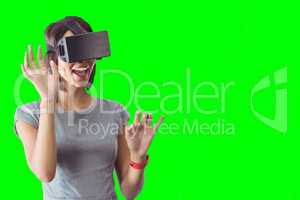 Composite image of businesswoman holding virtual glasses on a white background