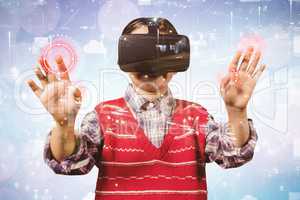 Composite image of young boy in red jumper with virtual reality headset