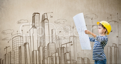 Composite image of boy in hard hat reading a plan