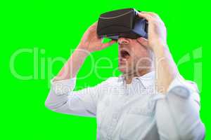 Composite image of businessman holding virtual glasses