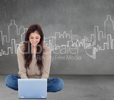 Composite image of brunette sitting on floor using laptop