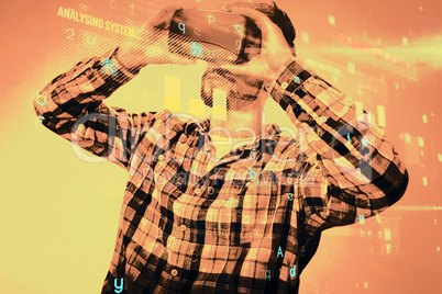 Composite image of man using an oculus