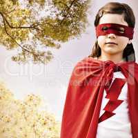 Composite image of portrait of girl in red eye mask and cape
