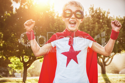 Composite image of little boy dressed as superman