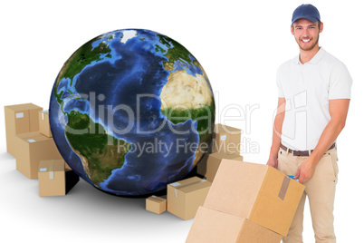 Composite image of happy delivery man pushing trolley of boxes