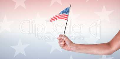 Cropped image of hand holding American flag