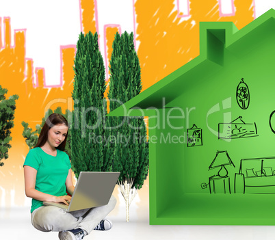 Composite image of student sitting on floor in library using laptop