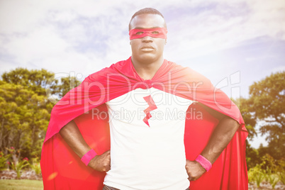 Composite image of man wearing superhero costume