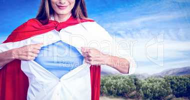 Composite image of woman pretending to be superhero