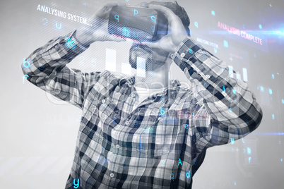 Composite image of man using an oculus