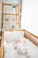 Baby boy relaxing on a cradle