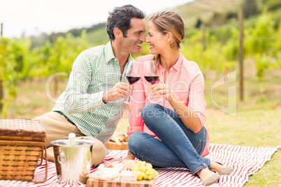 Happy couple holding glasses of wine