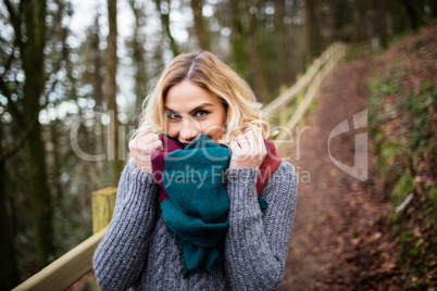 Beautiful smiling woman in forest