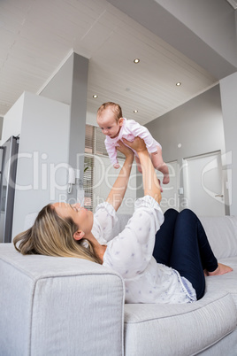 Mother playing with her baby