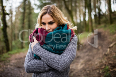 Beautiful woman standing in forest