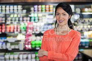 Portrait of woman standing in grocery section