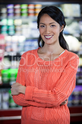 Portrait of woman standing in grocery section