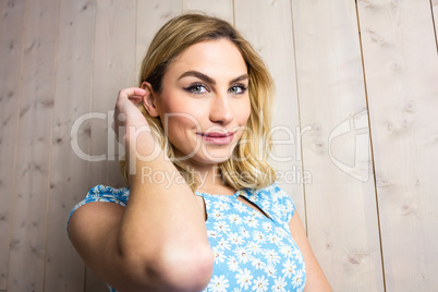 Portrait of smiling woman posing against texture background