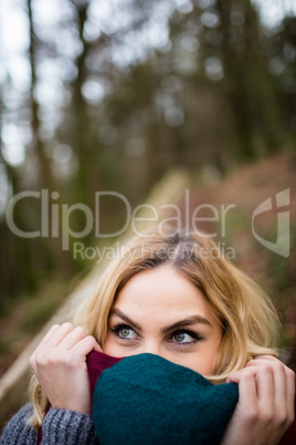 Beautiful smiling woman in forest