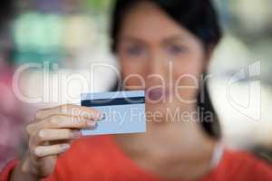 Close-up of woman holding credit card