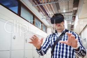 Student using virtual reality headset in locker room