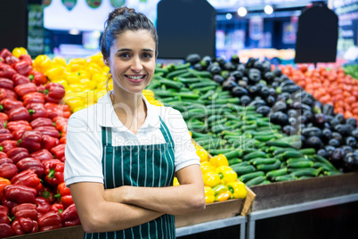 Female staff standing with arm crossed in organic section