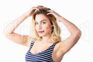 Portrait of beautiful woman posing against white background