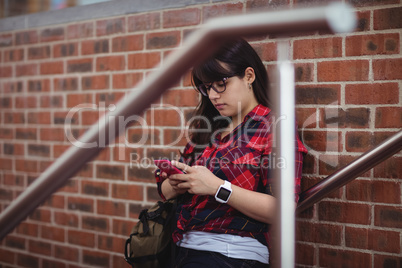 Female student using mobile phone