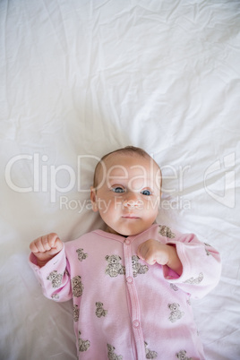 Cute baby boy relaxing on bed