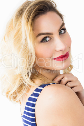 Portrait of beautiful woman posing against white background