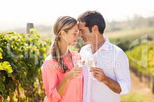 Happy couple holding glasses of wine