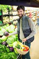 Portrait of man buying vegetables in organic shop