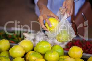 Woman buying sweet lime