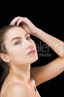 Portrait of beautiful woman posing against black background