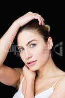 Portrait of beautiful woman posing against black background