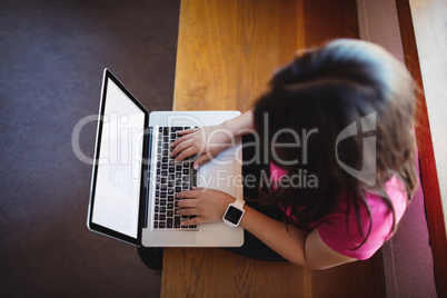 Female student using laptop