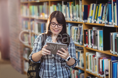 Female student using digital tablet